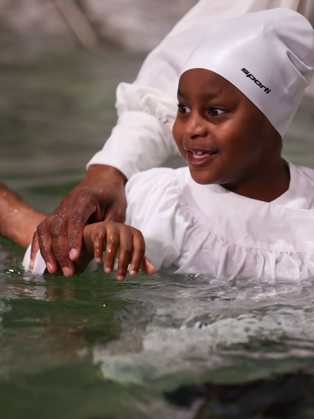 Young person being baptized